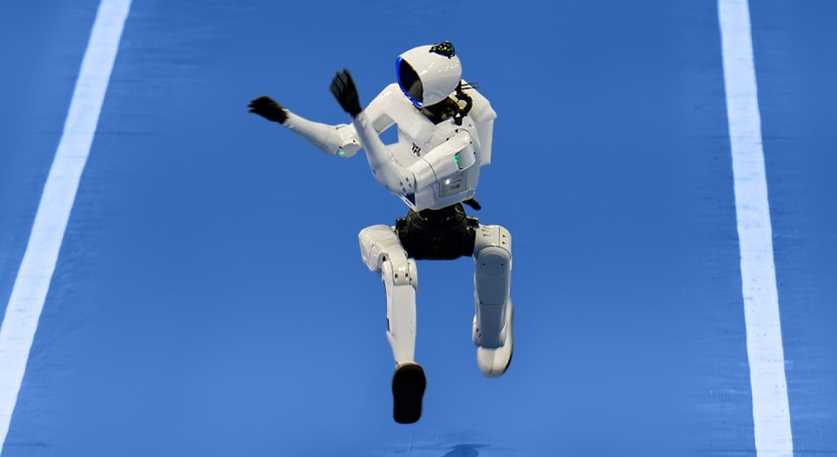 Tiangong Omni humanoid robot in its forward-tilted racing posture at the World Humanoid Robot Games